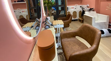 Elegant salon station at Rachel French Hairdresser, Sydney, New South Wales, AU, featuring leather chair and mirror.