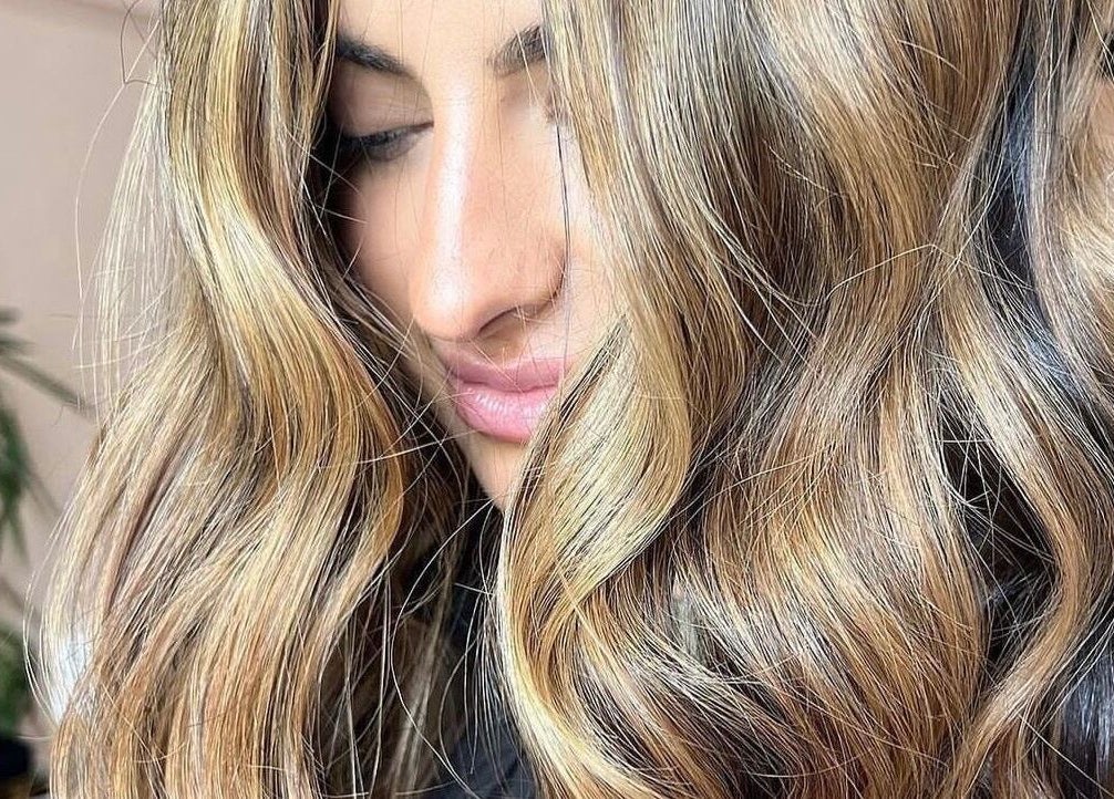 Glossy blonde hair styled at Socially Painted, Edinburgh, Scotland, GB. Perfect for vibrant beauty sessions.