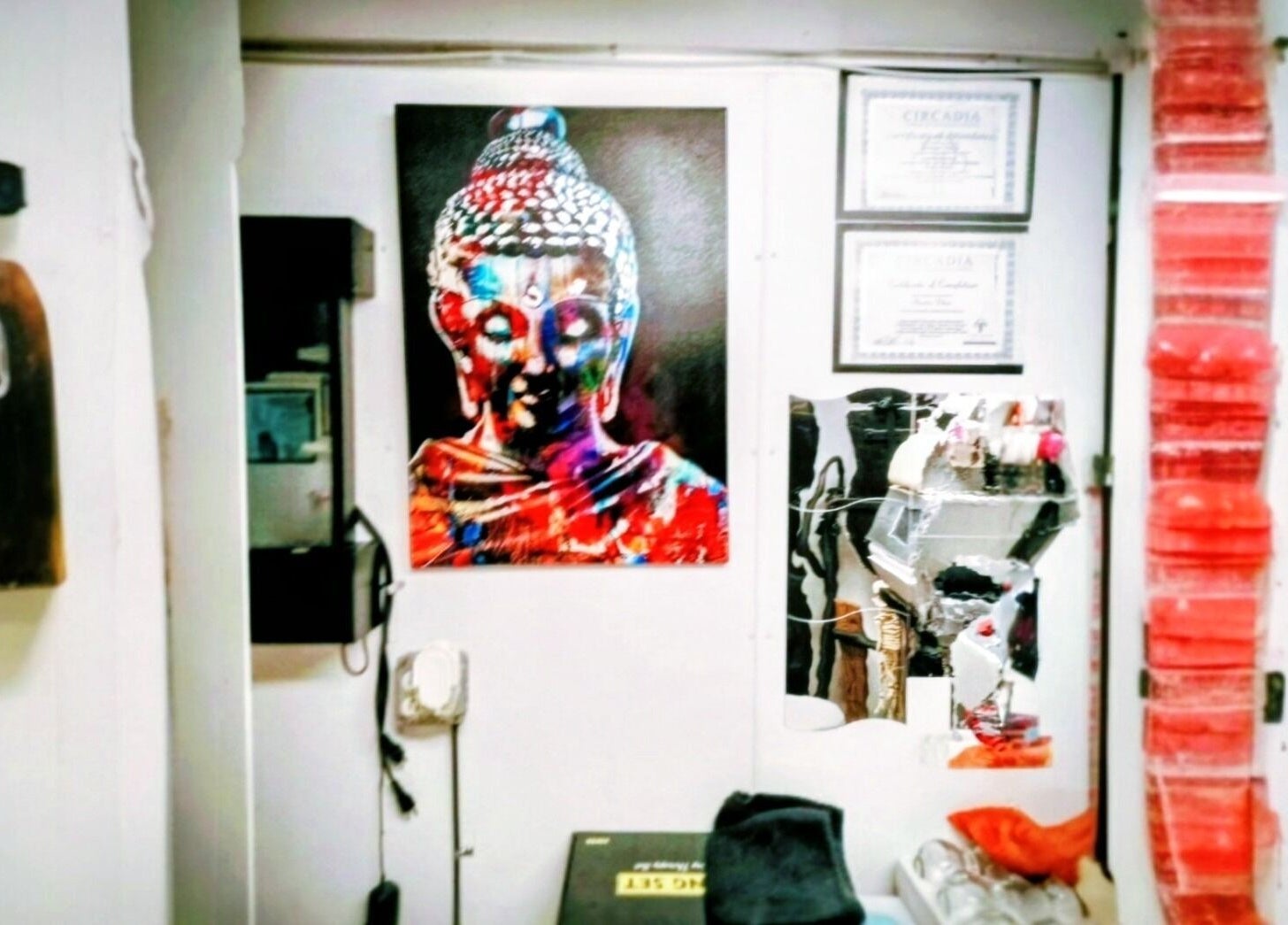 Colorful Buddha art at Motif Medi Spa, Nassau, New Providence, BS, enhances tranquil ambiance.