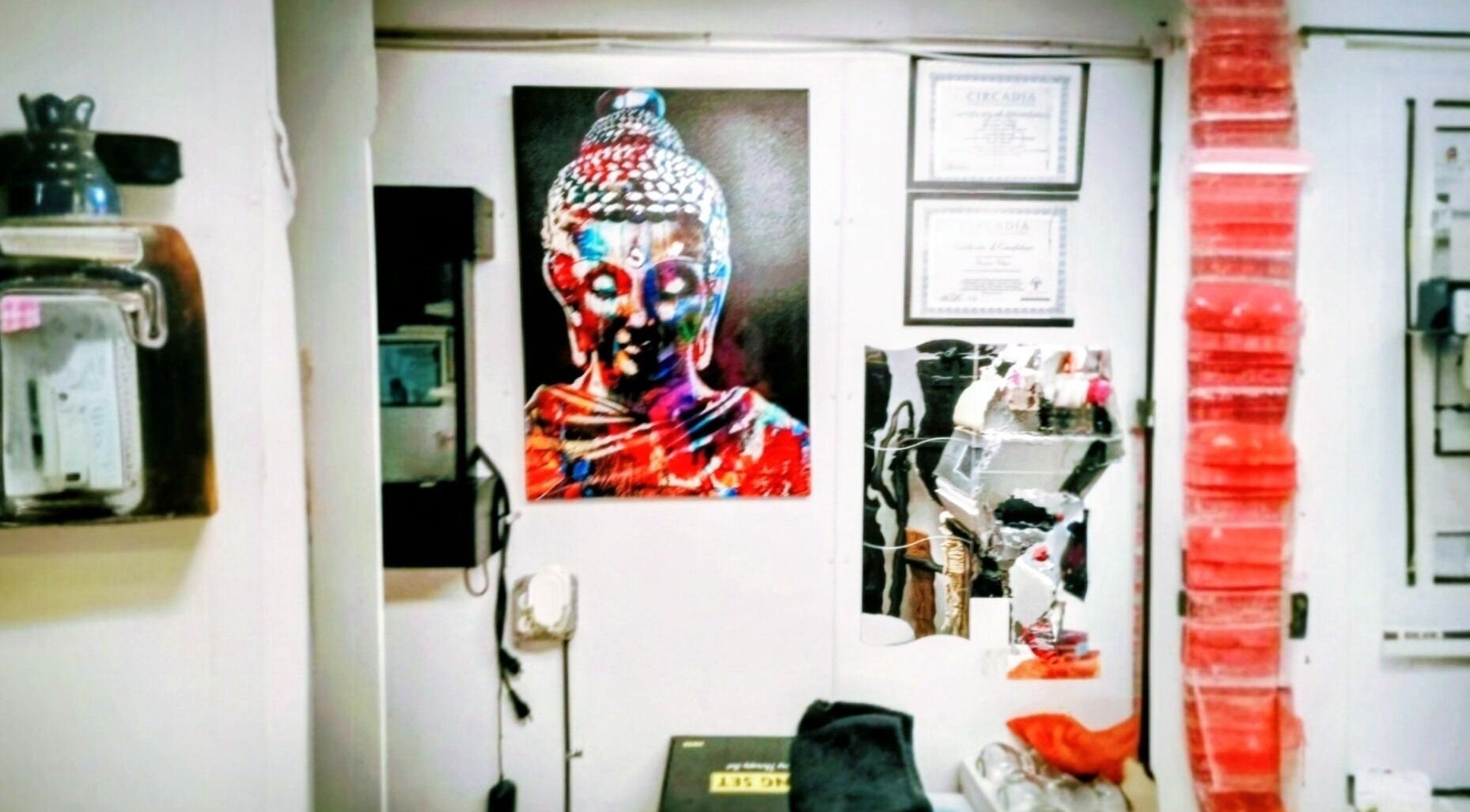 Colorful Buddha art at Motif Medi Spa, Nassau, New Providence, BS, enhances tranquil ambiance.