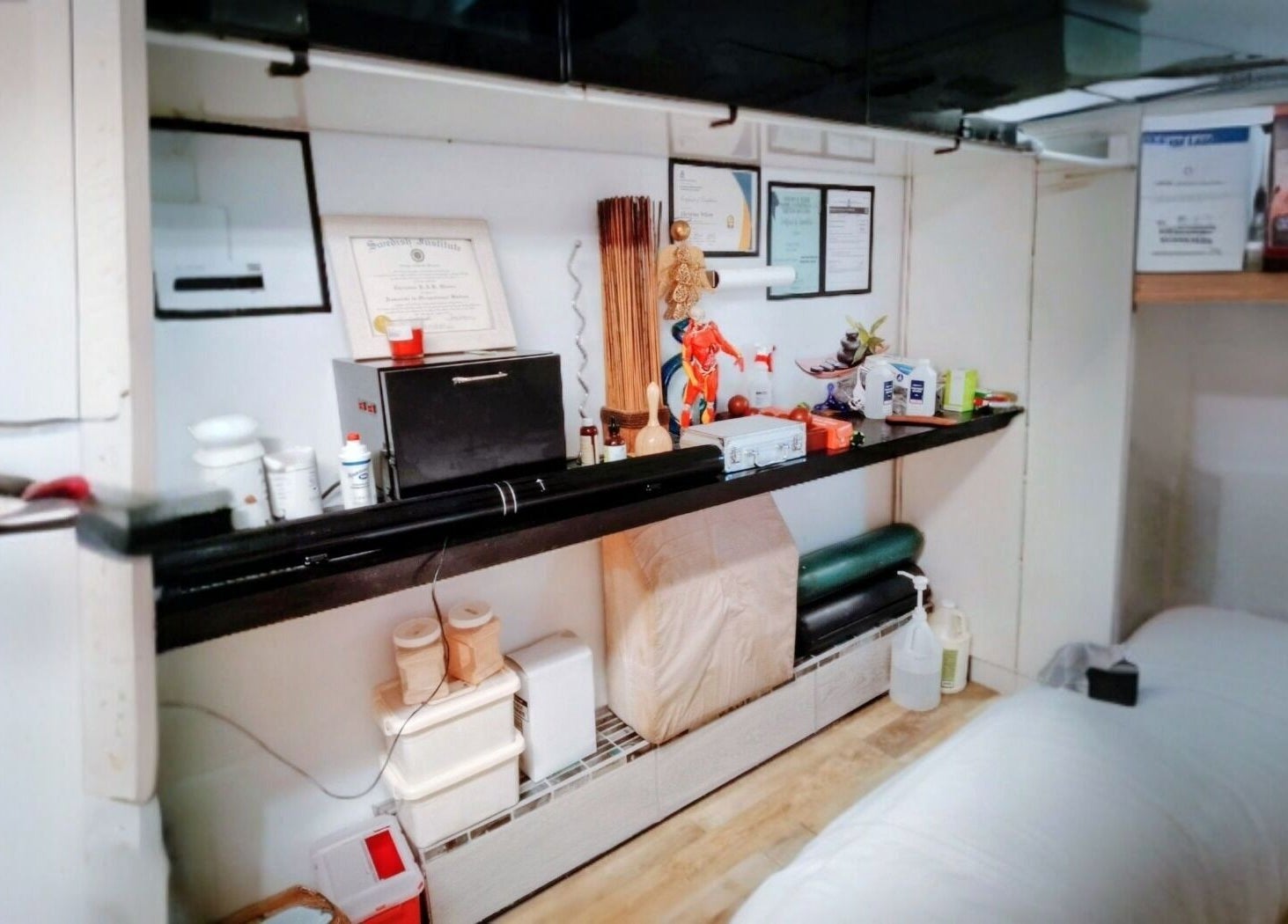 Motif Medi Spa treatment room with products and certificates, Nassau, New Providence, BS.