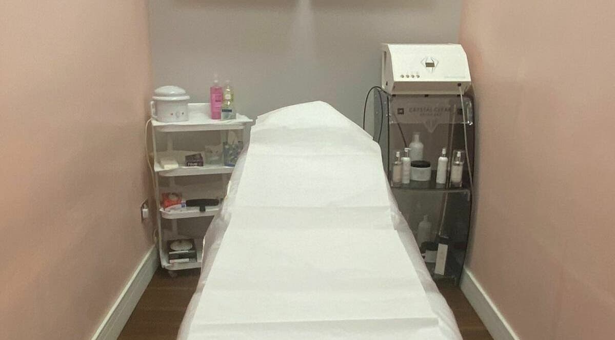 Treatment room at Ami Brow and Lash Bar in Rugby, England, GB, featuring a comfortable bed and beauty equipment.