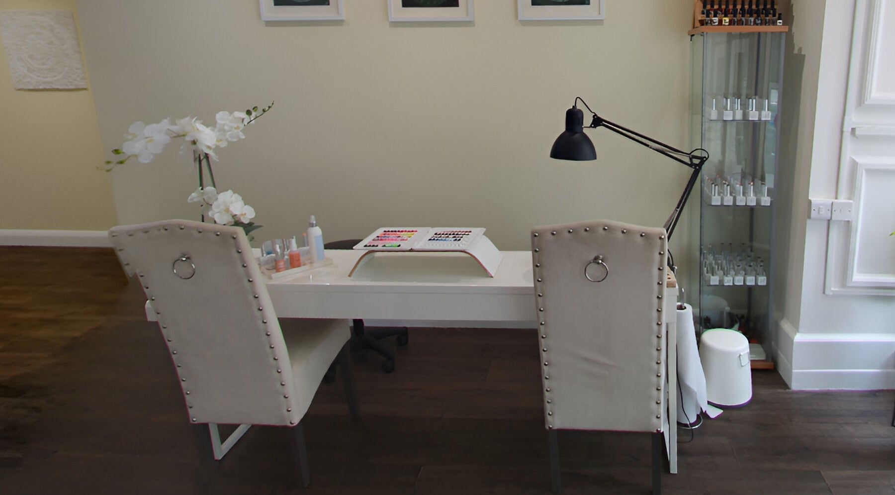 Elegant nail care setup at Natural Body Cafe, Poole, England, GB. Features cozy chairs and modern decor.