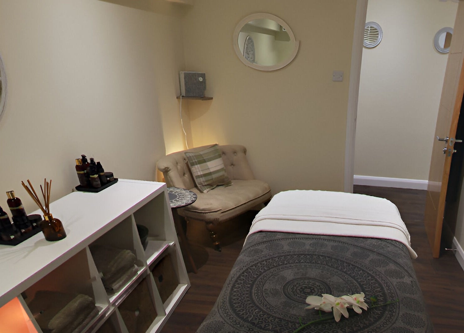 Tranquil spa room with massage table at Natural Body Cafe, Poole, England, GB, for ultimate relaxation.