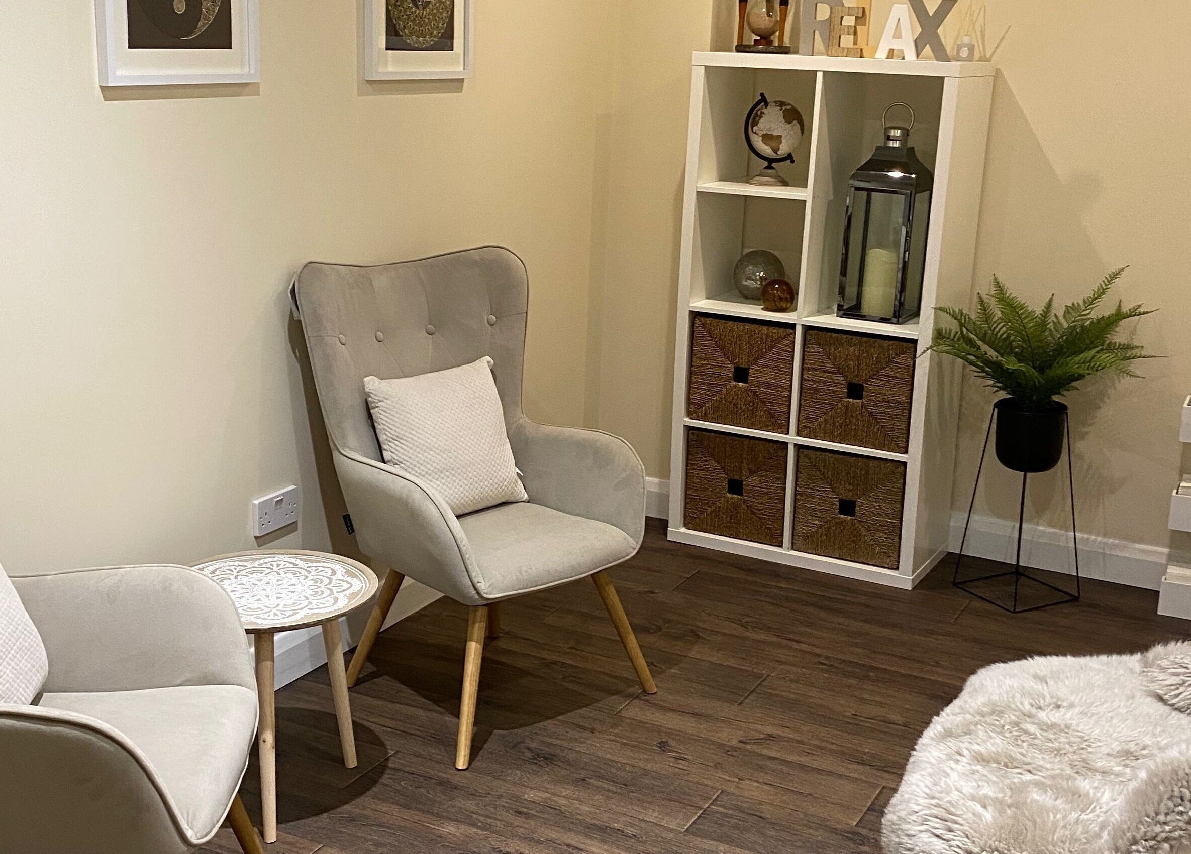 Cozy relaxation corner at Natural Body Cafe, Poole, England, GB featuring soft chairs and calming decor.