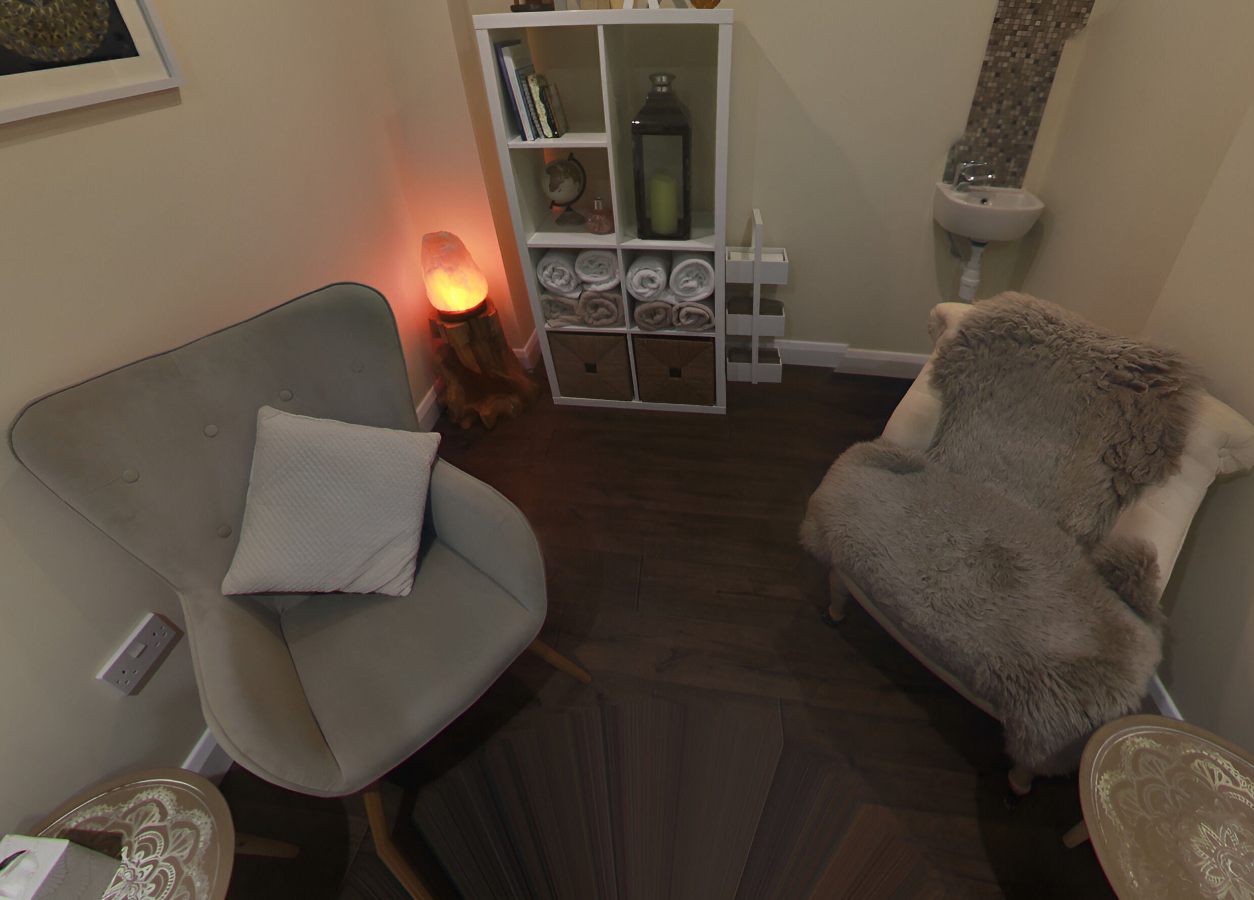 Cozy relaxation corner at Natural Body Cafe, Poole, England, GB featuring plush chairs and ambient lighting.