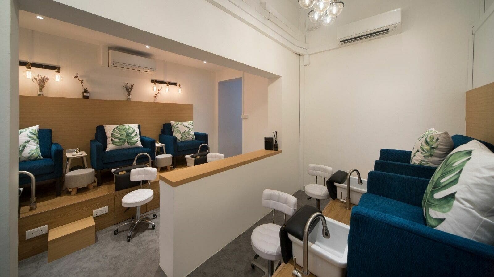 Inviting interior of Painted Nail Bar at River Valley, Singapore, SG with plush seating and serene decor.