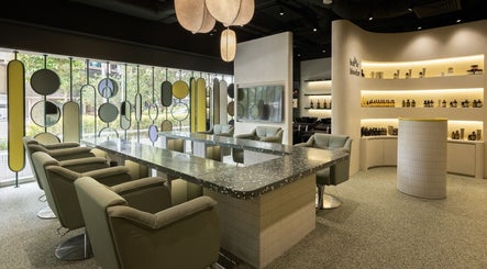 Modern interior of Bubble Blow Bar at Delfi Orchard, Singapore, SG with stylish chairs and decor.