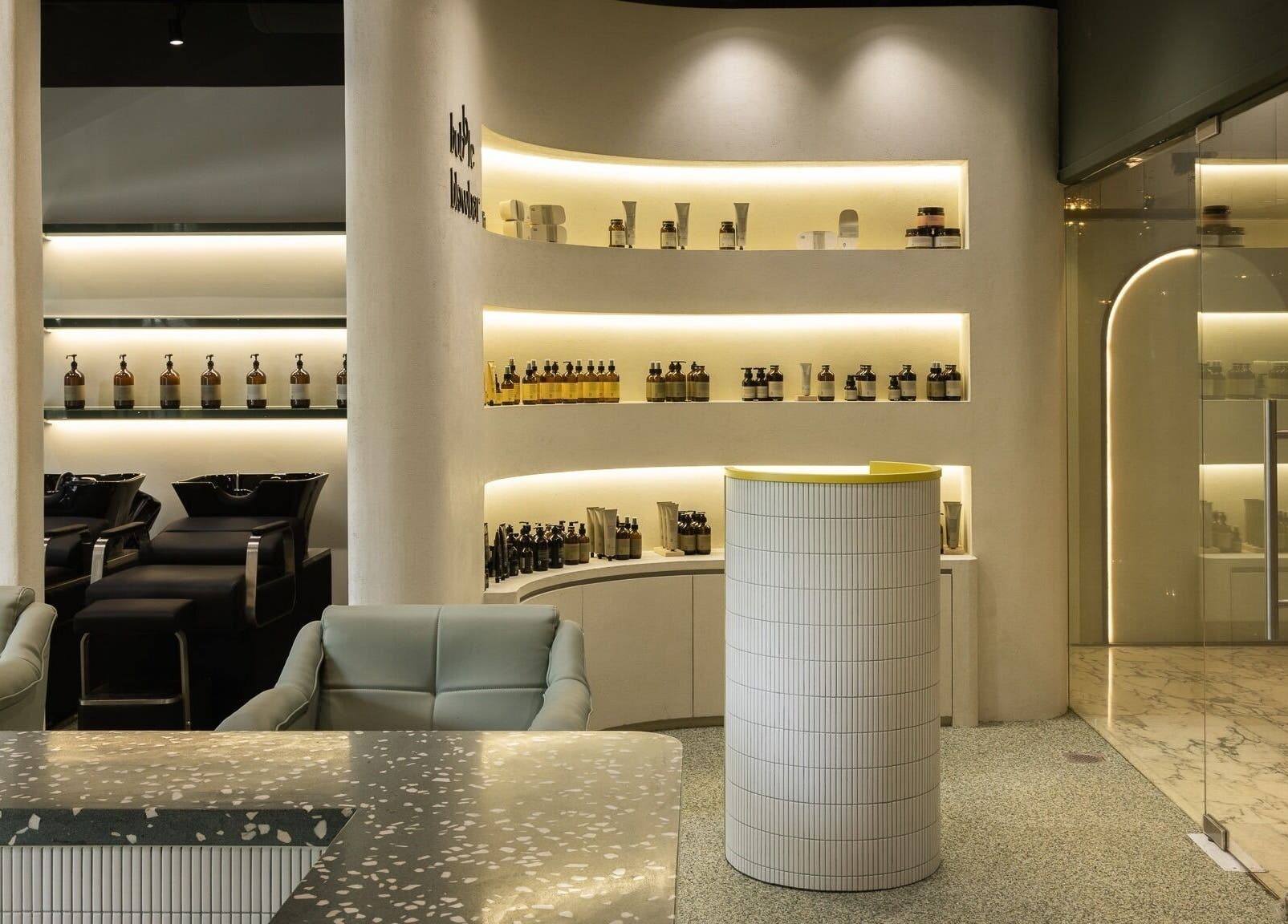 Modern interior of Bubble Blow Bar at Delfi Orchard in Singapore, showcasing sleek design and elegant amenities.
