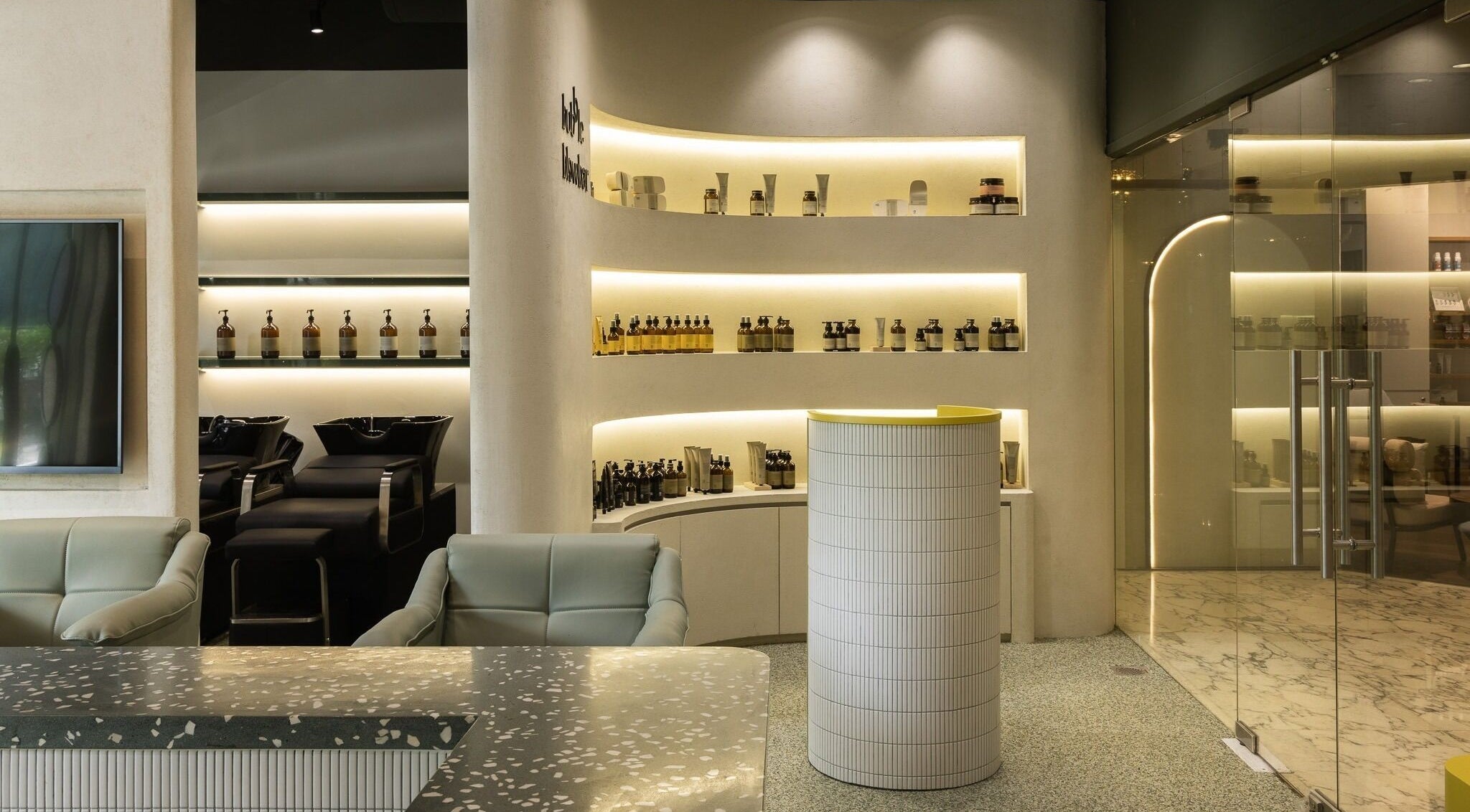 Modern interior of Bubble Blow Bar at Delfi Orchard in Singapore, showcasing sleek design and elegant amenities.