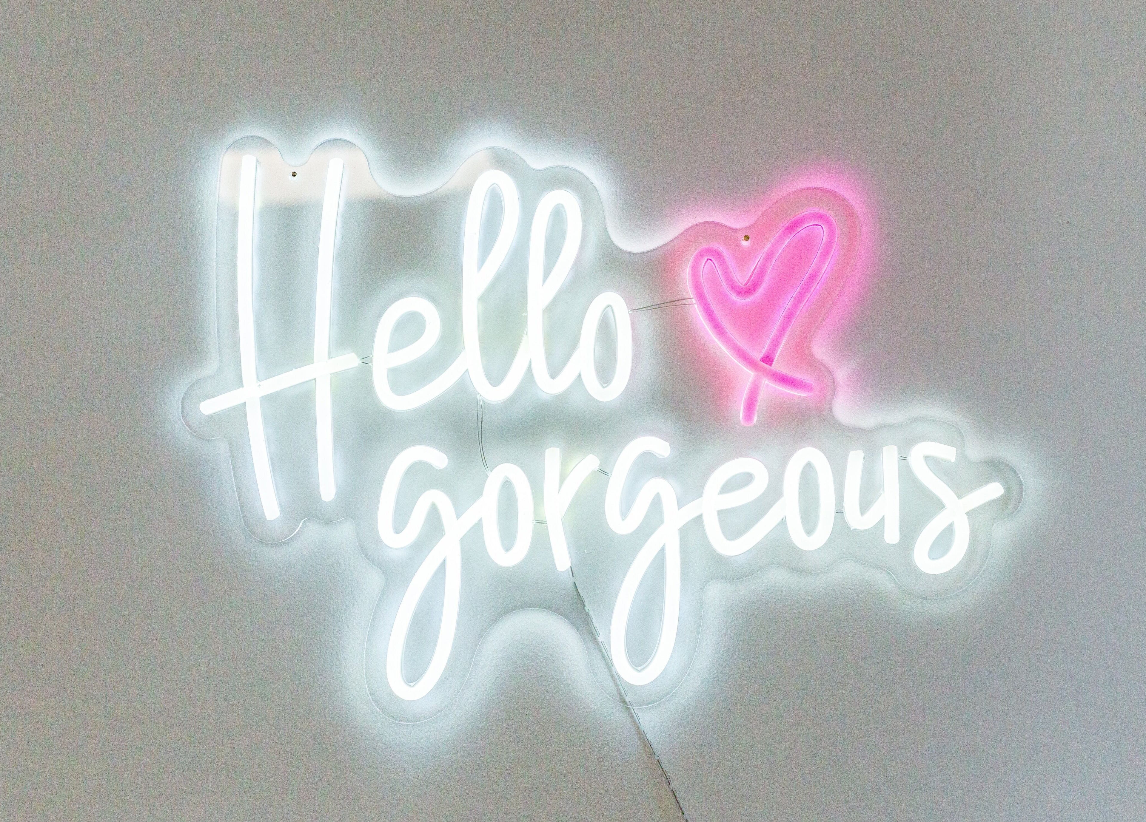 Neon sign 'Hello Gorgeous' at Bespoke Brow Design, Rustington, England, GB.