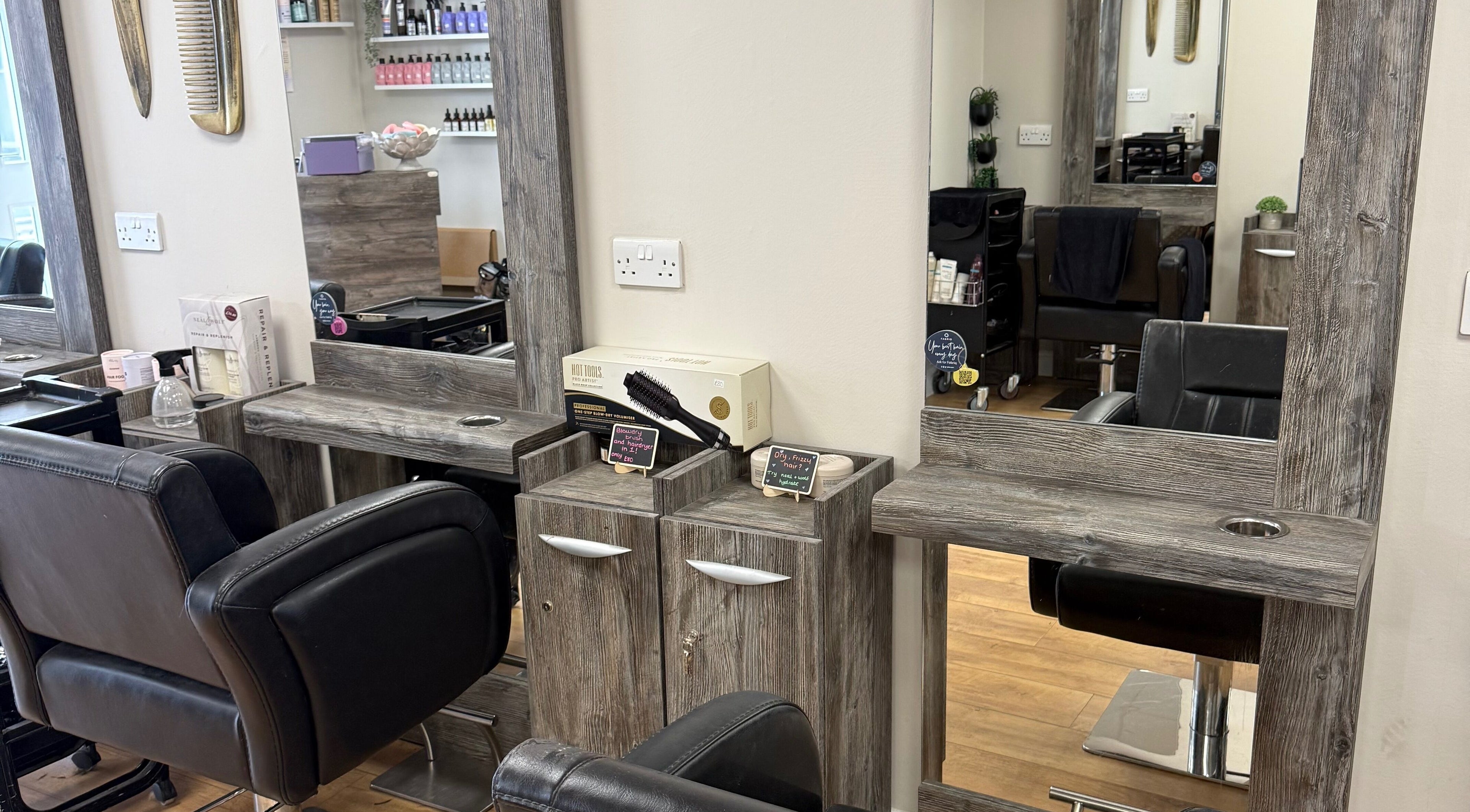 Elegant styling chairs and mirrors at Hairspray, Bingley, England, GB.
