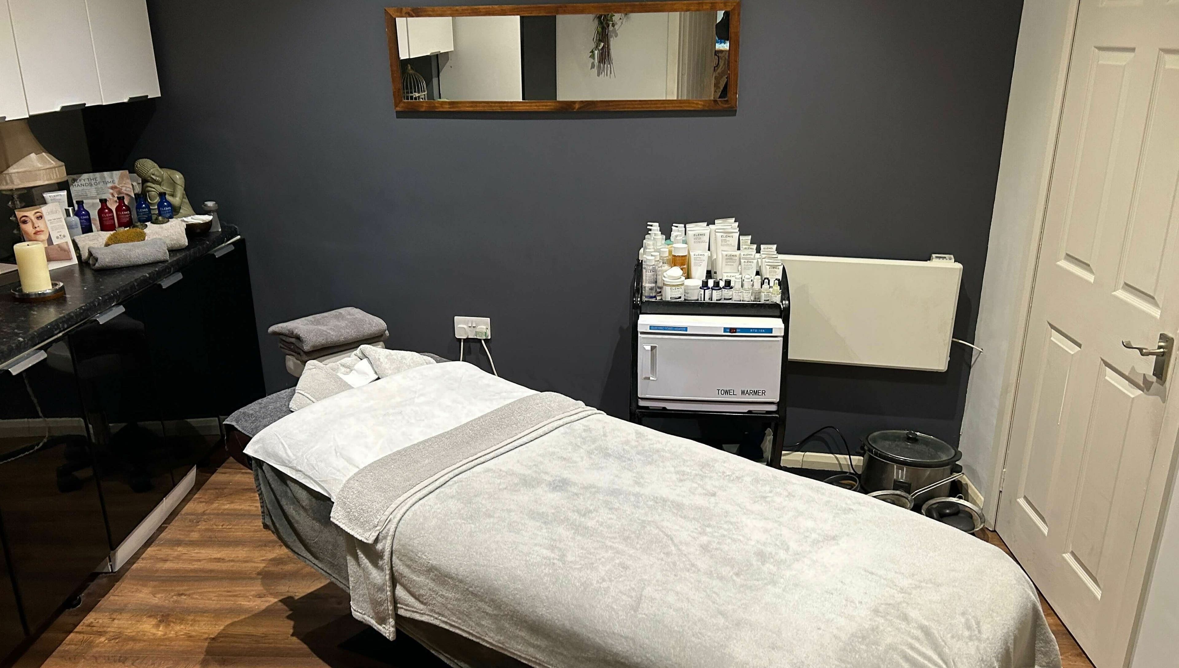 Tranquil treatment room at Pure Indulgence Day Spa, Merton, England, GB, showcasing relaxation therapy ambiance.