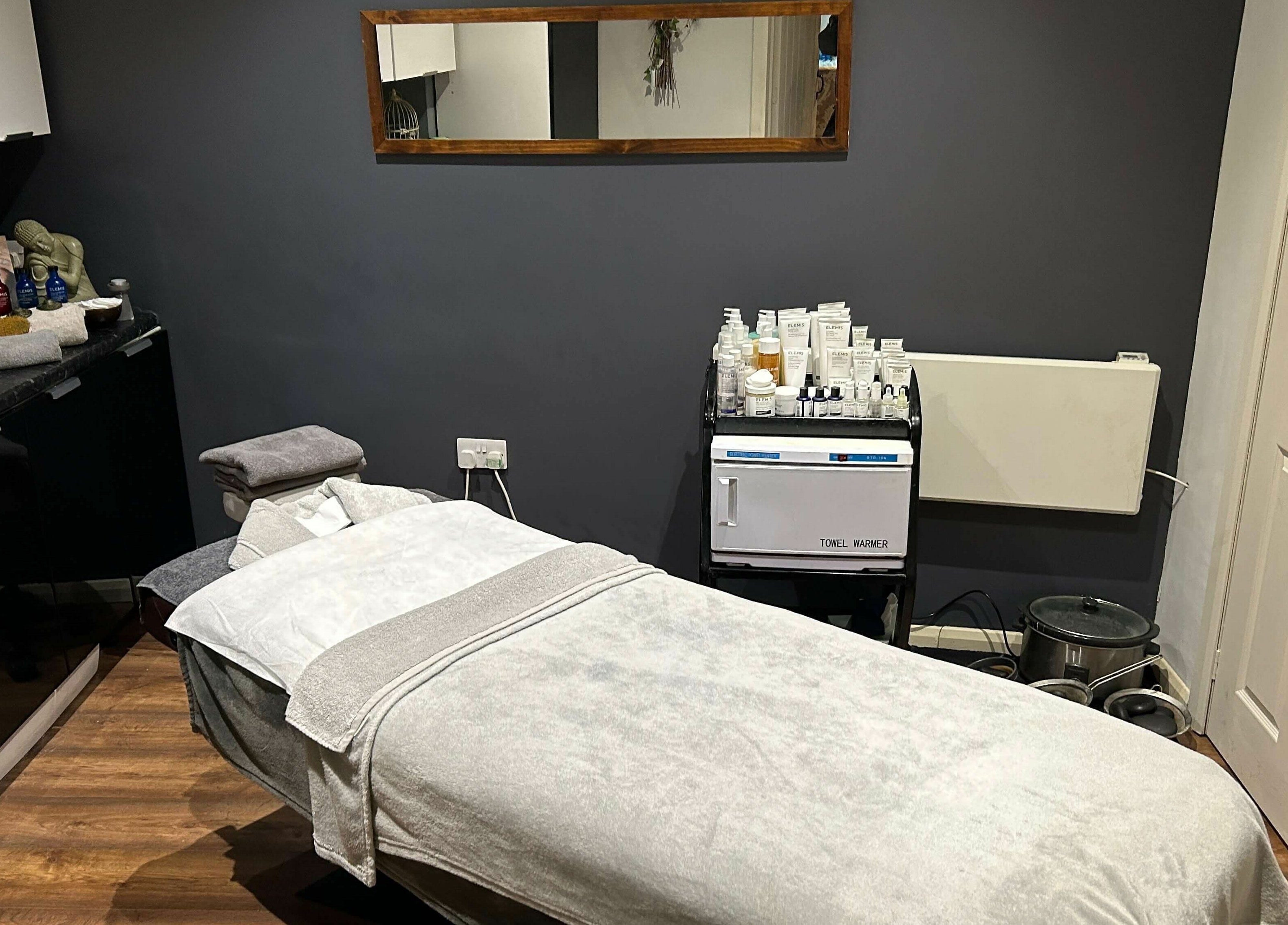 Tranquil treatment room at Pure Indulgence Day Spa, Merton, England, GB, showcasing relaxation therapy ambiance.