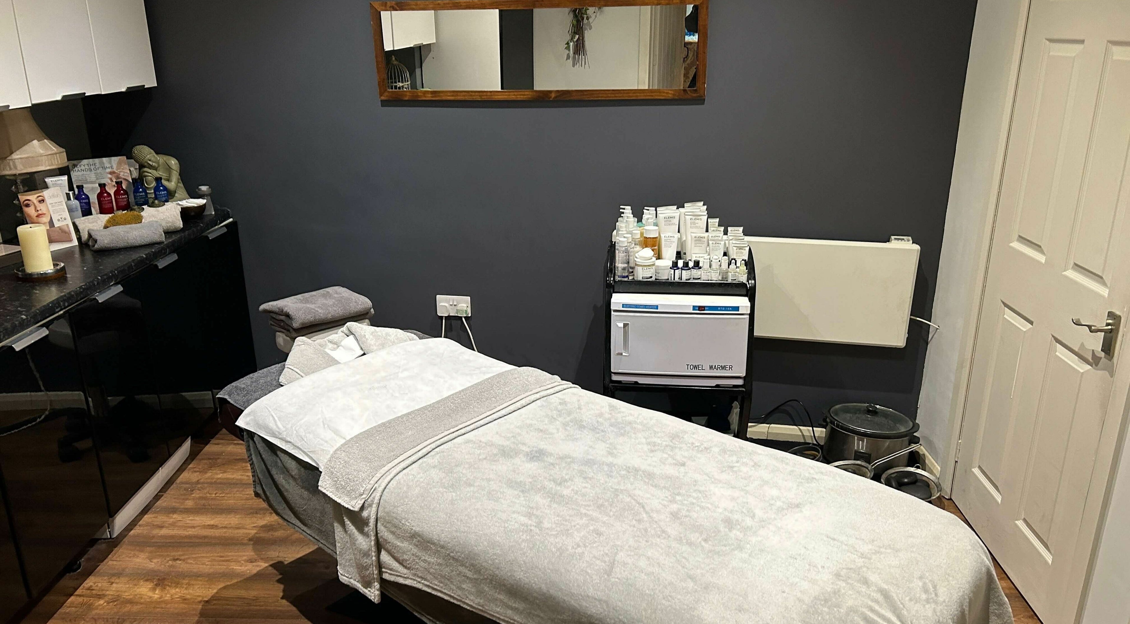 Tranquil treatment room at Pure Indulgence Day Spa, Merton, England, GB, showcasing relaxation therapy ambiance.