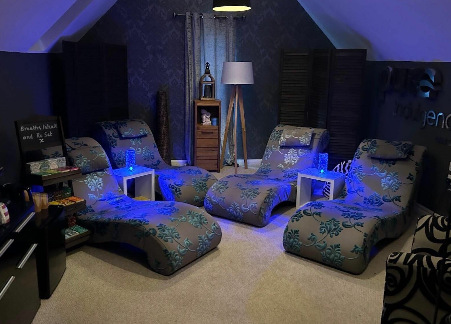 Relaxing lounge chairs at Pure Indulgence Day Spa, Merton, England for ultimate comfort and peace.