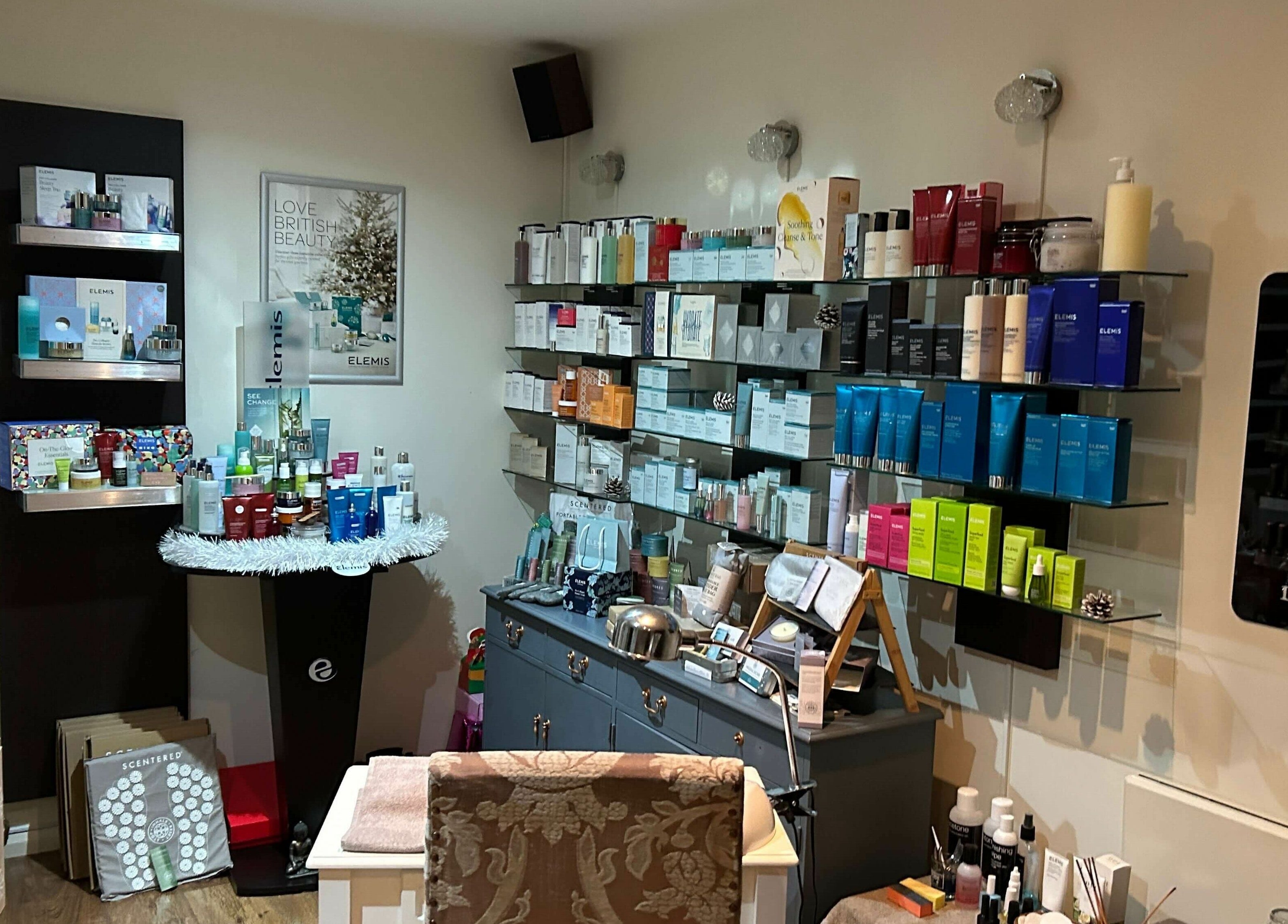 Skincare shelves at Pure Indulgence Day Spa in Merton, England, GB showcasing premium beauty products.