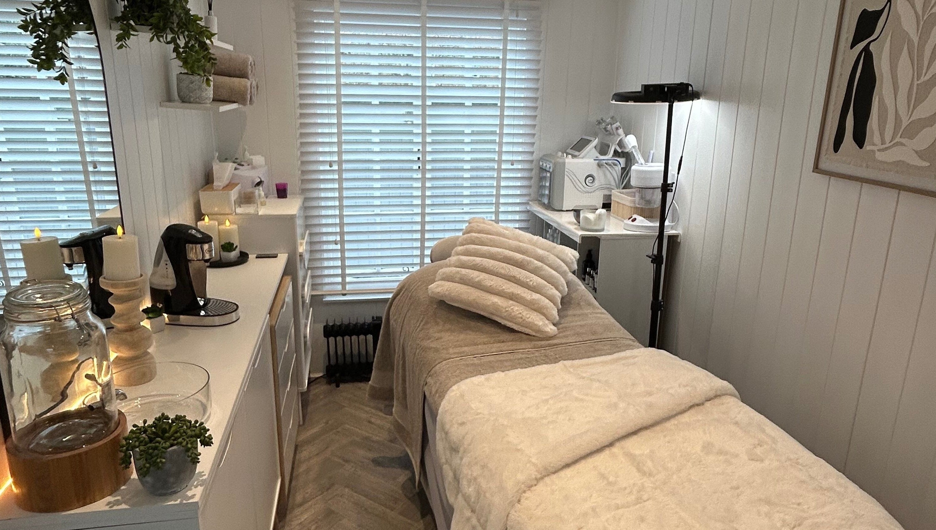 Relaxing treatment room at The Beauty Hut in Wivelsfield Green, England, GB, featuring a serene setup.
