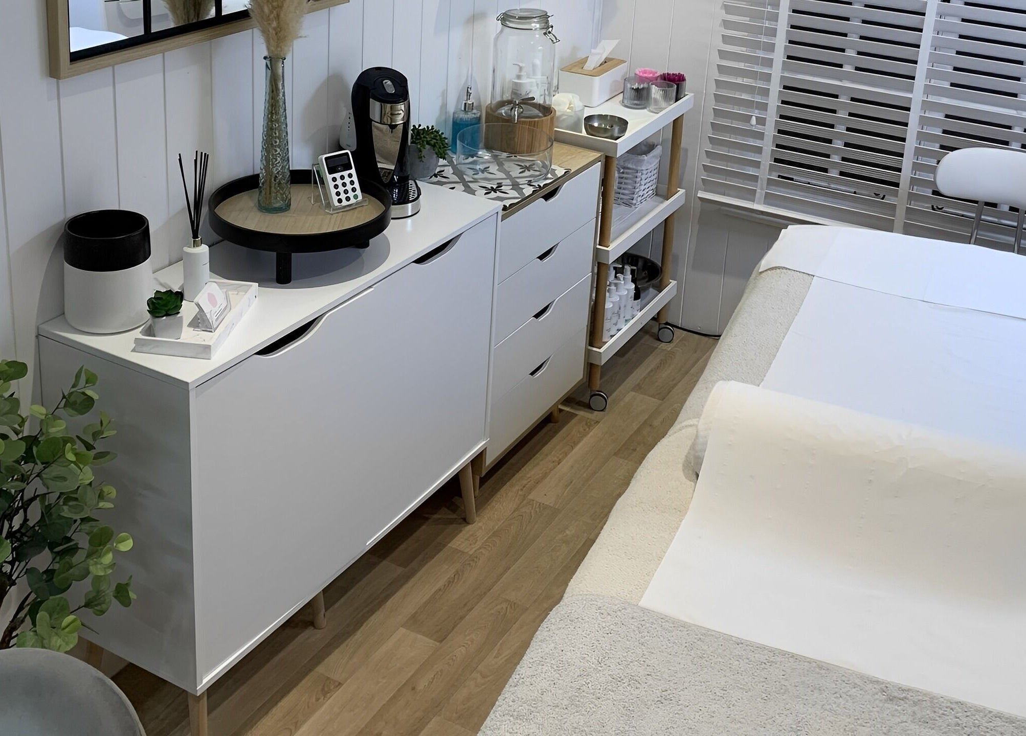 Tranquil treatment room at The Beauty Hut, Wivelsfield Green, England, GB. Cozy and inviting ambiance.