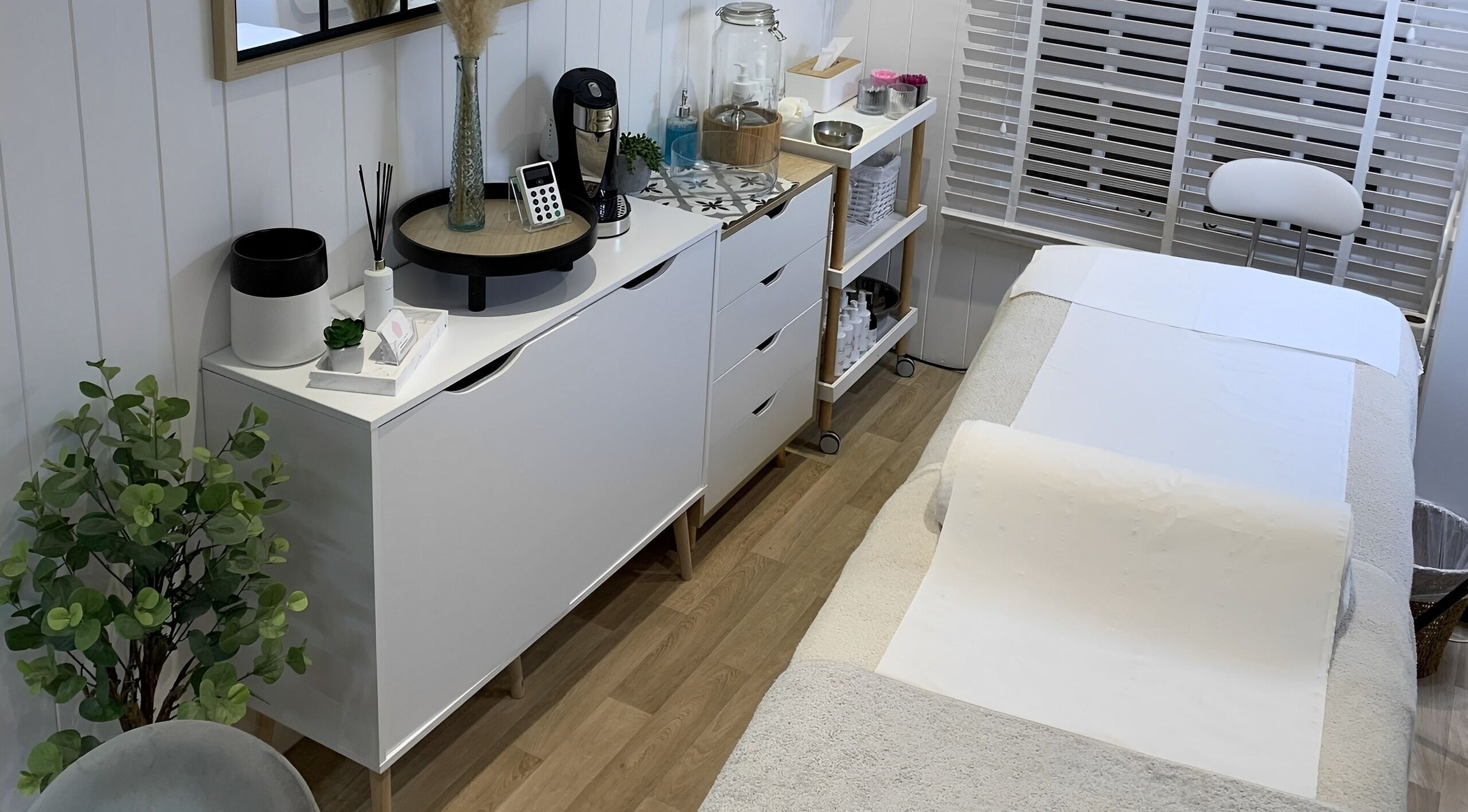 Tranquil treatment room at The Beauty Hut, Wivelsfield Green, England, GB. Cozy and inviting ambiance.