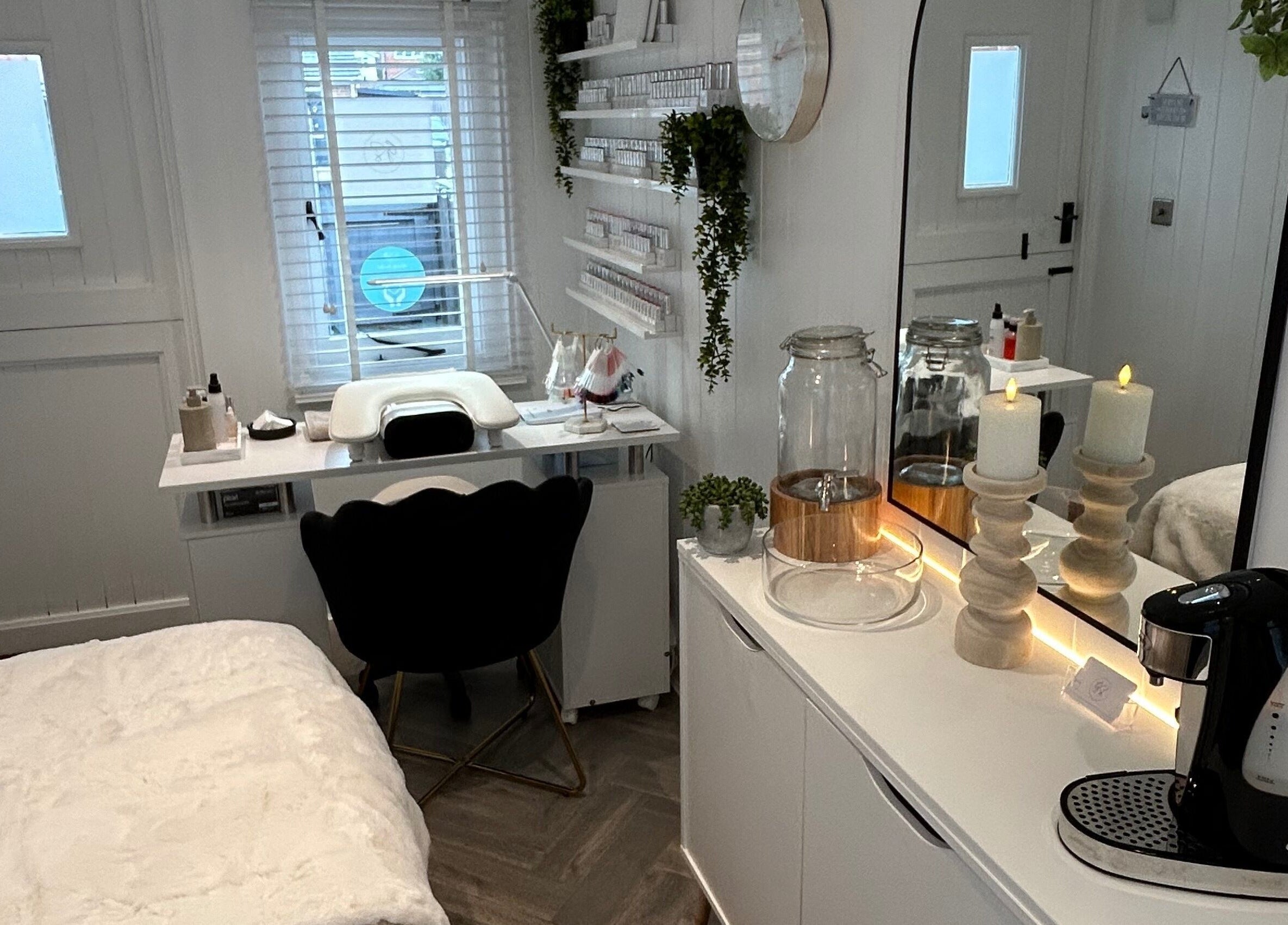 Cozy treatment room at The Beauty Hut, Wivelsfield Green, England, GB with soft lighting and elegant decor.