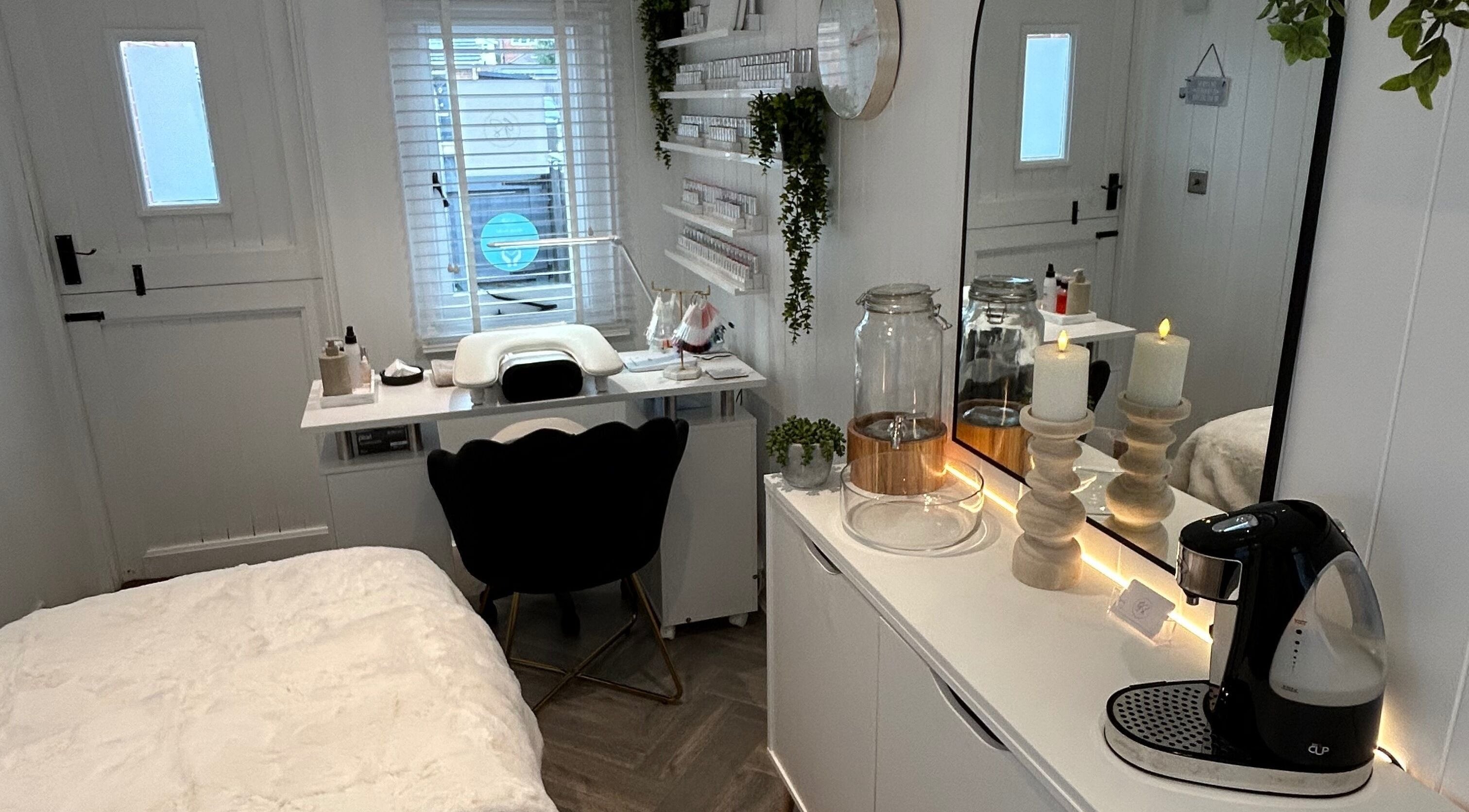 Cozy treatment room at The Beauty Hut, Wivelsfield Green, England, GB with soft lighting and elegant decor.