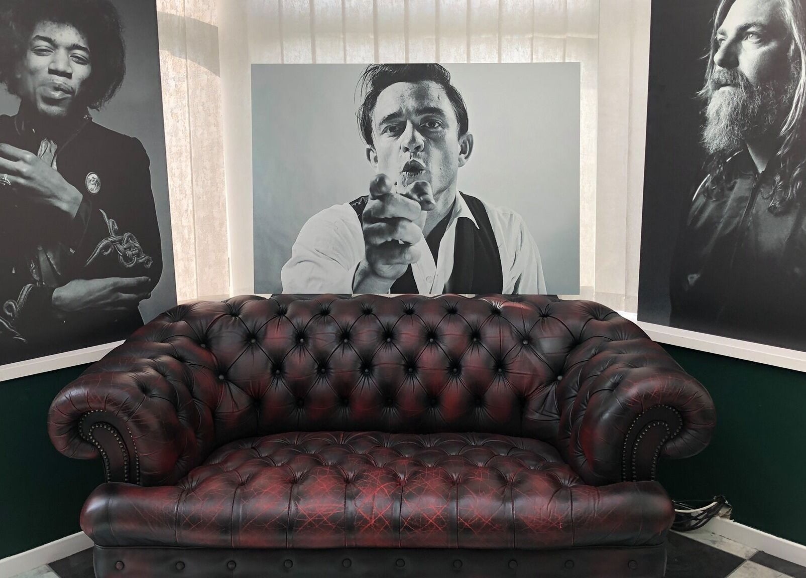Chic leather sofa in stylish lounge at The Local - Paul Merrilees Gentleman’s Barber, west, England, GB.