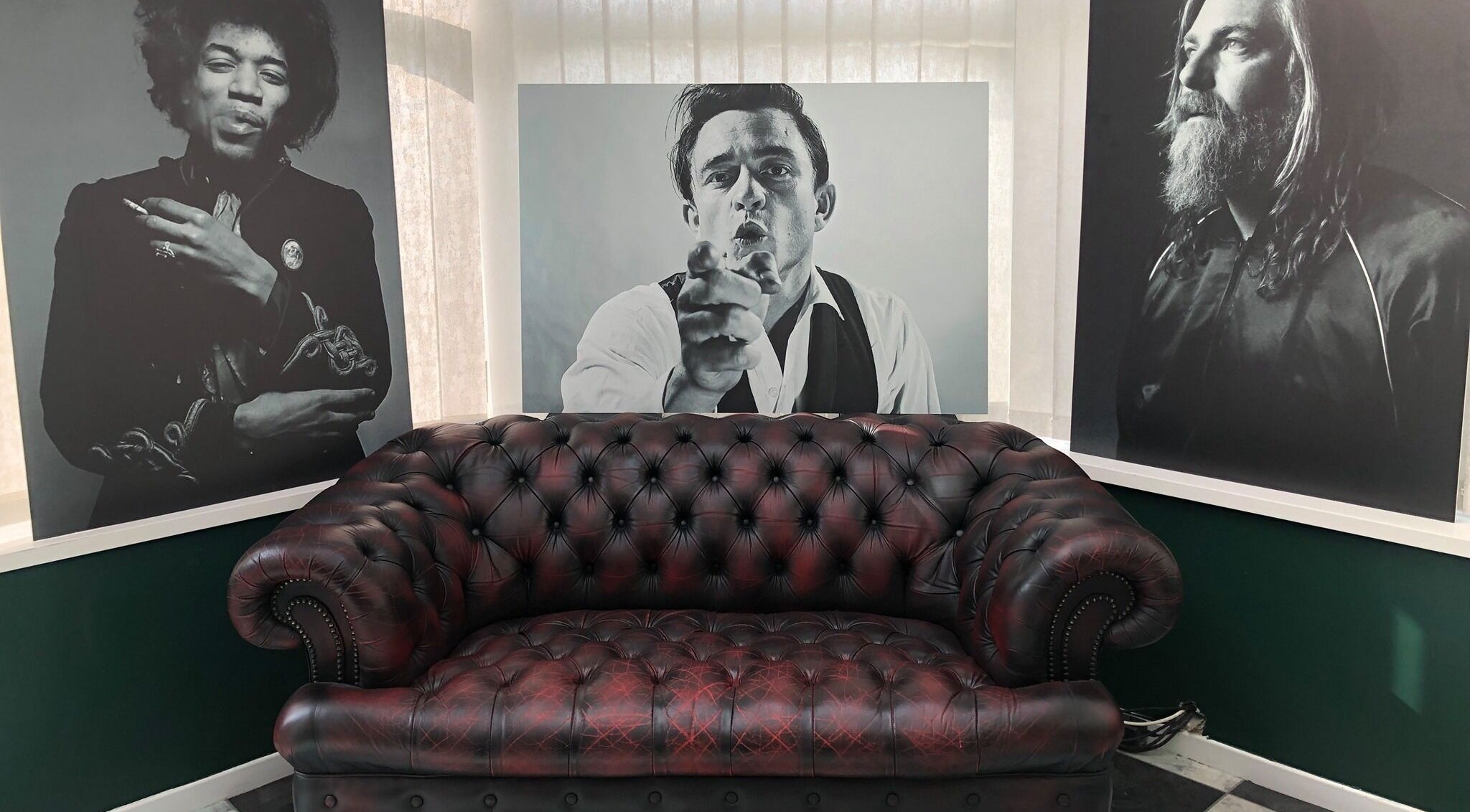 Chic leather sofa in stylish lounge at The Local - Paul Merrilees Gentleman’s Barber, west, England, GB.