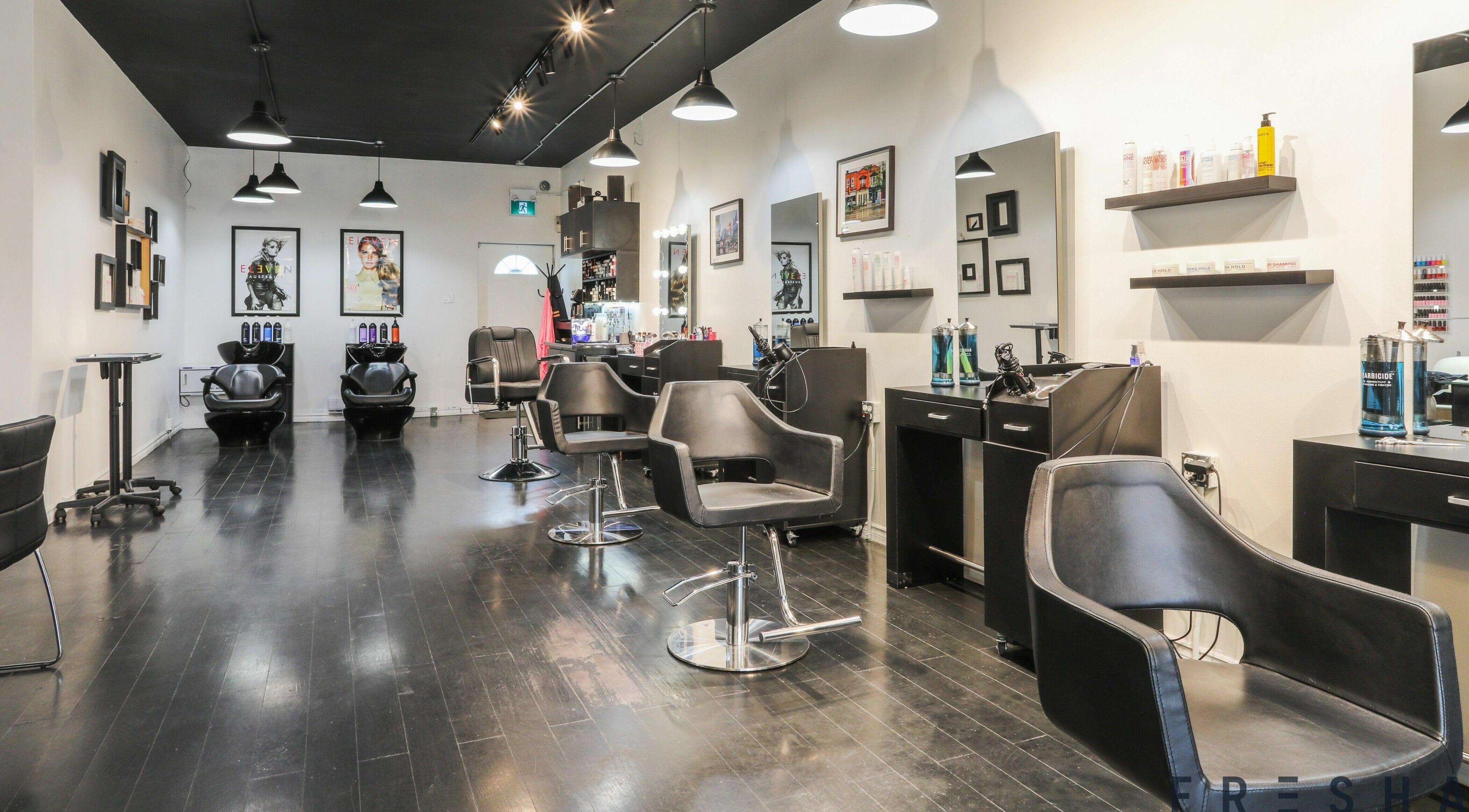 Stylish salon interior at Emerald Hair and Beauty in Toronto, Ontario, CA, showcasing modern furnishings and decor.