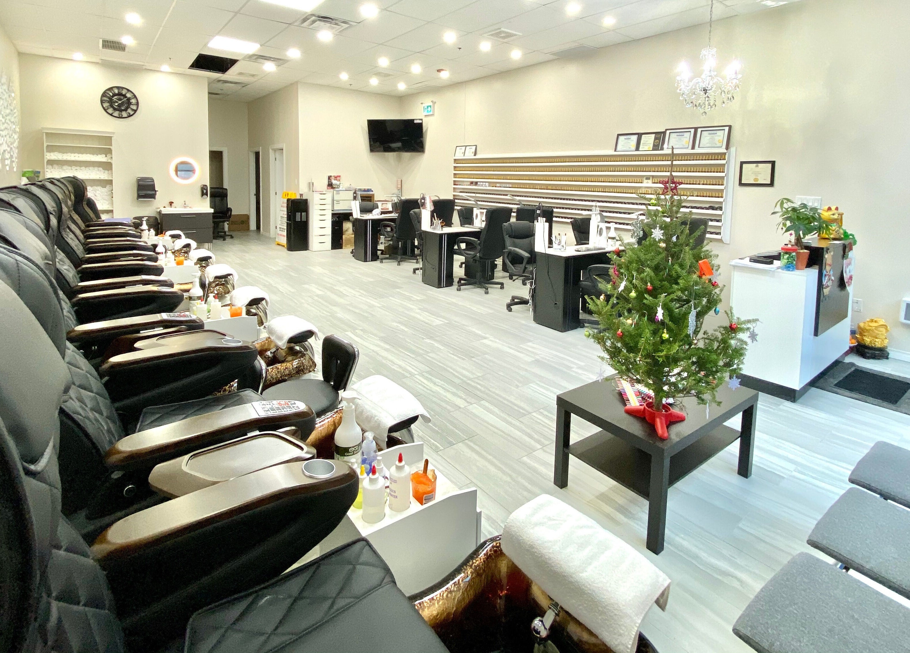 Bright interior of Glorious Nails and Spa in Ottawa, Ontario, CA with modern seating and decor.