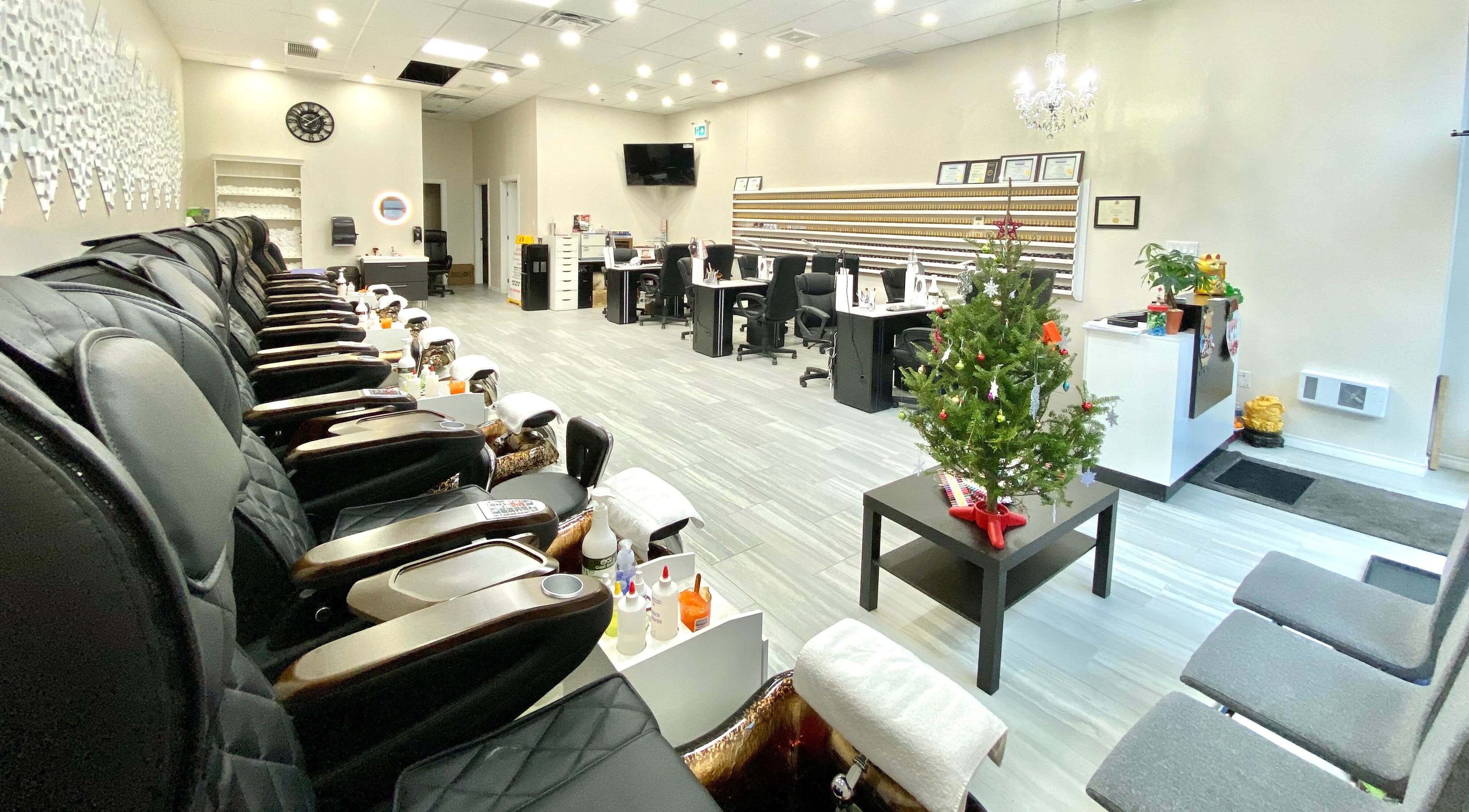 Bright interior of Glorious Nails and Spa in Ottawa, Ontario, CA with modern seating and decor.