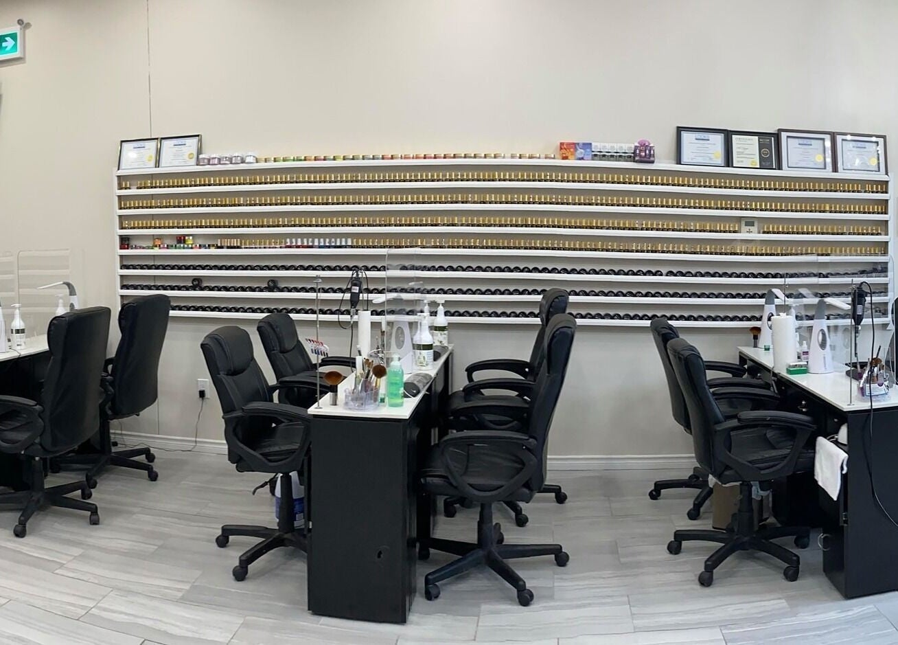 Elegant nail salon interior at Glorious Nails and Spa, Ottawa, Ontario, CA featuring polished workstations.