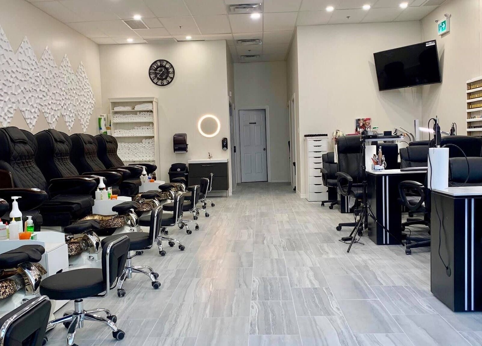 Modern interior of Glorious Nails and Spa, Ottawa, Ontario, CA. Luxurious pedicure and manicure stations.