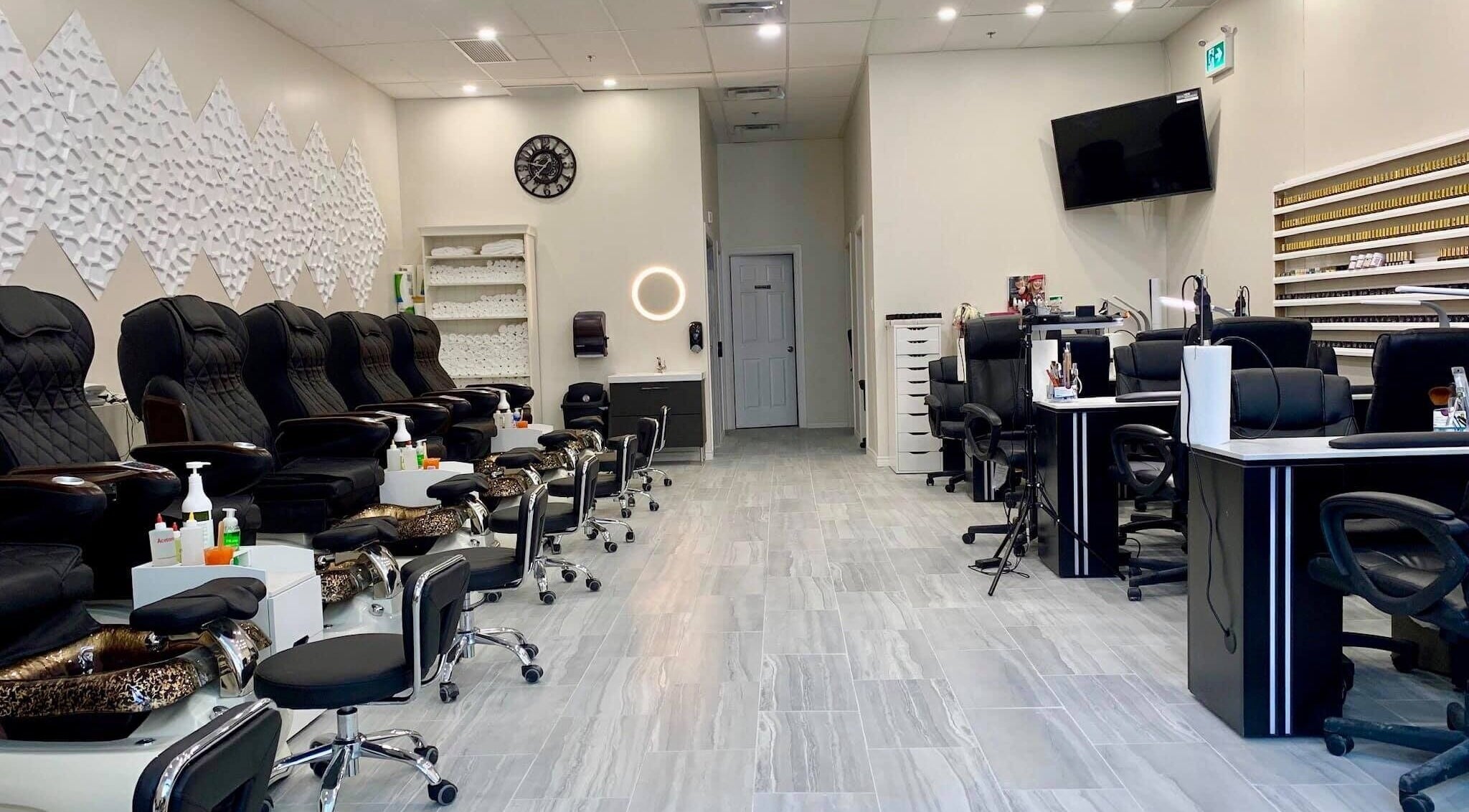 Modern interior of Glorious Nails and Spa, Ottawa, Ontario, CA. Luxurious pedicure and manicure stations.