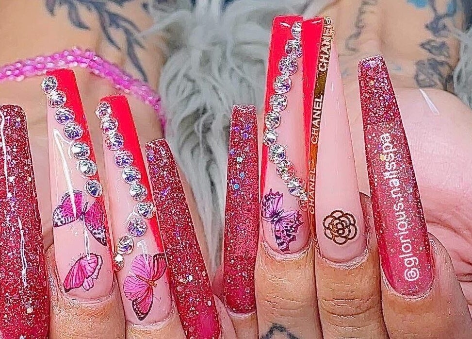 Glamorous butterfly nail art at Glorious Nails and Spa, Ottawa, Ontario, CA with sparkling design.