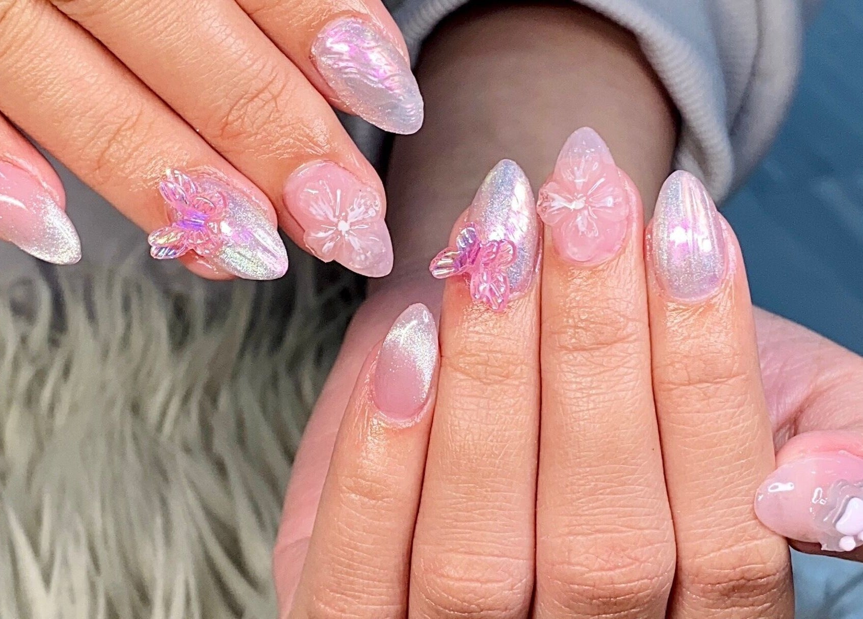 Intricate floral nail art at Glorious Nails and Spa, Ottawa, Ontario, CA showcasing shimmering pink designs.