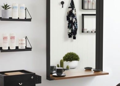 Stylish salon interior at Tilucio, Dublin, County Dublin, IE with shelves and chic decor.