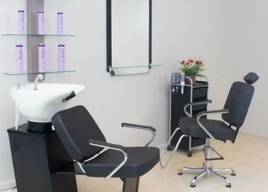Modern salon setup at Tilucio, Dublin, County Dublin, IE. Featuring sleek chairs and hair wash station.