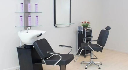 Modern salon setup at Tilucio, Dublin, County Dublin, IE. Featuring sleek chairs and hair wash station.
