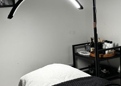 Cozy treatment room at Sunday Rose in Shadoxhurst, England, GB, featuring a comfortable spa bed and ambient lighting.