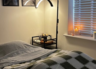 Relaxing spa room at Sunday Rose, Shadoxhurst, England, GB with ambient lighting and treatment bed.