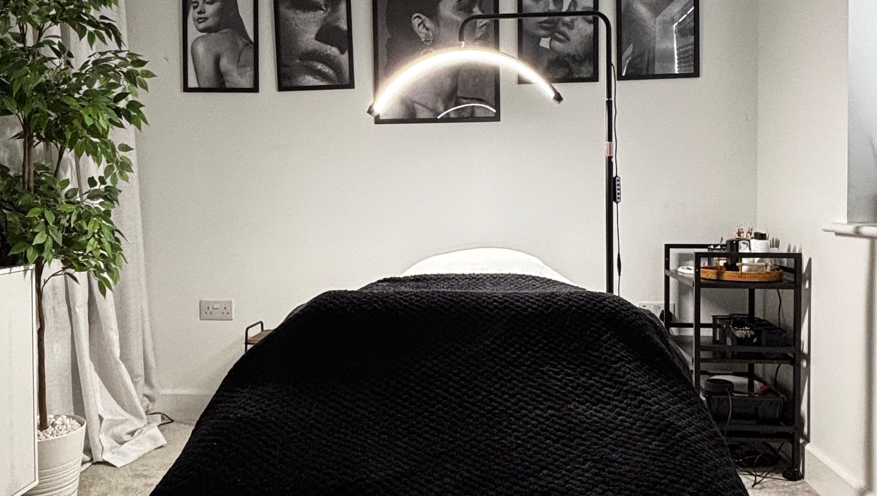 Modern treatment room at Sunday Rose, Shadoxhurst, England, GB, featuring a cozy bed and serene decor.