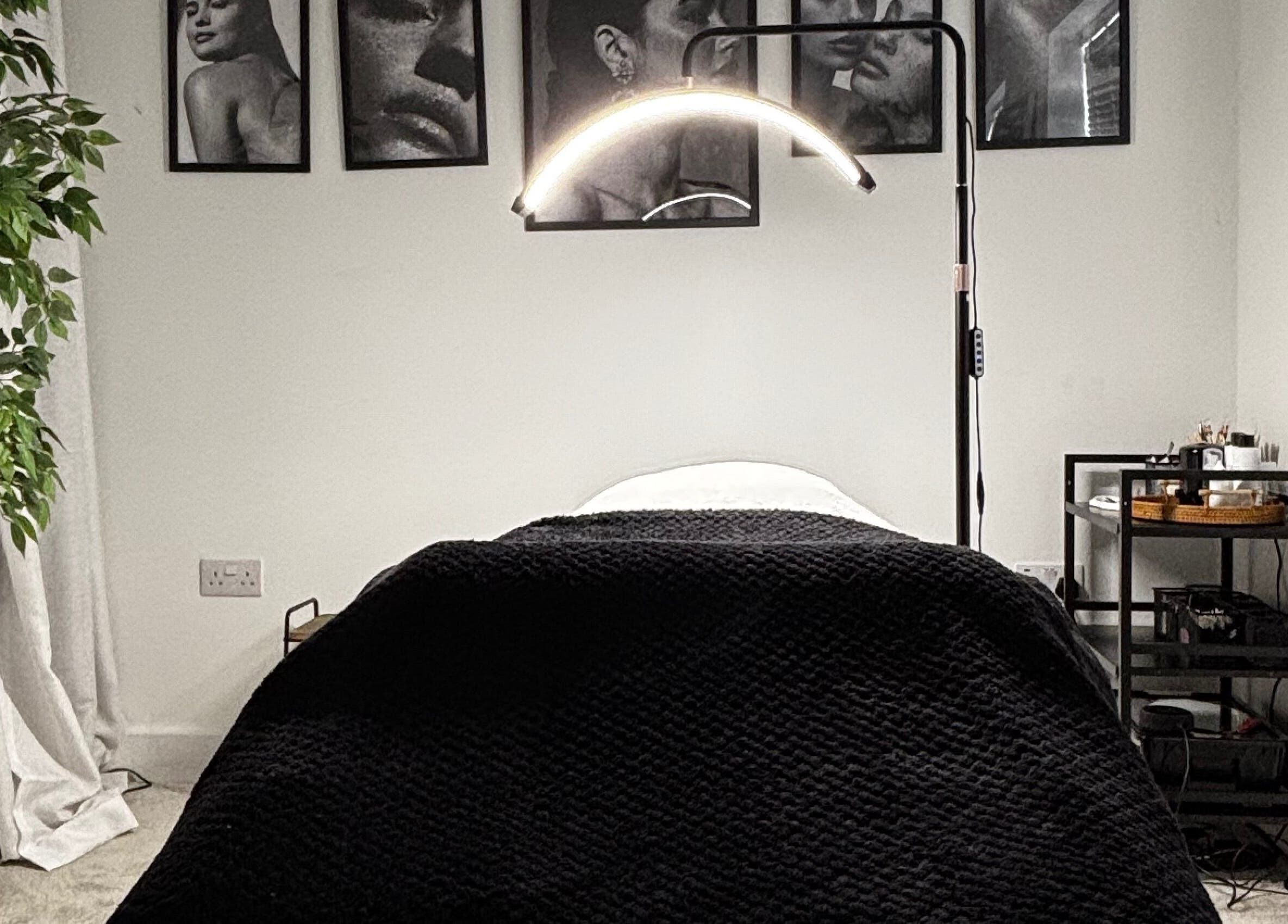 Modern treatment room at Sunday Rose, Shadoxhurst, England, GB, featuring a cozy bed and serene decor.