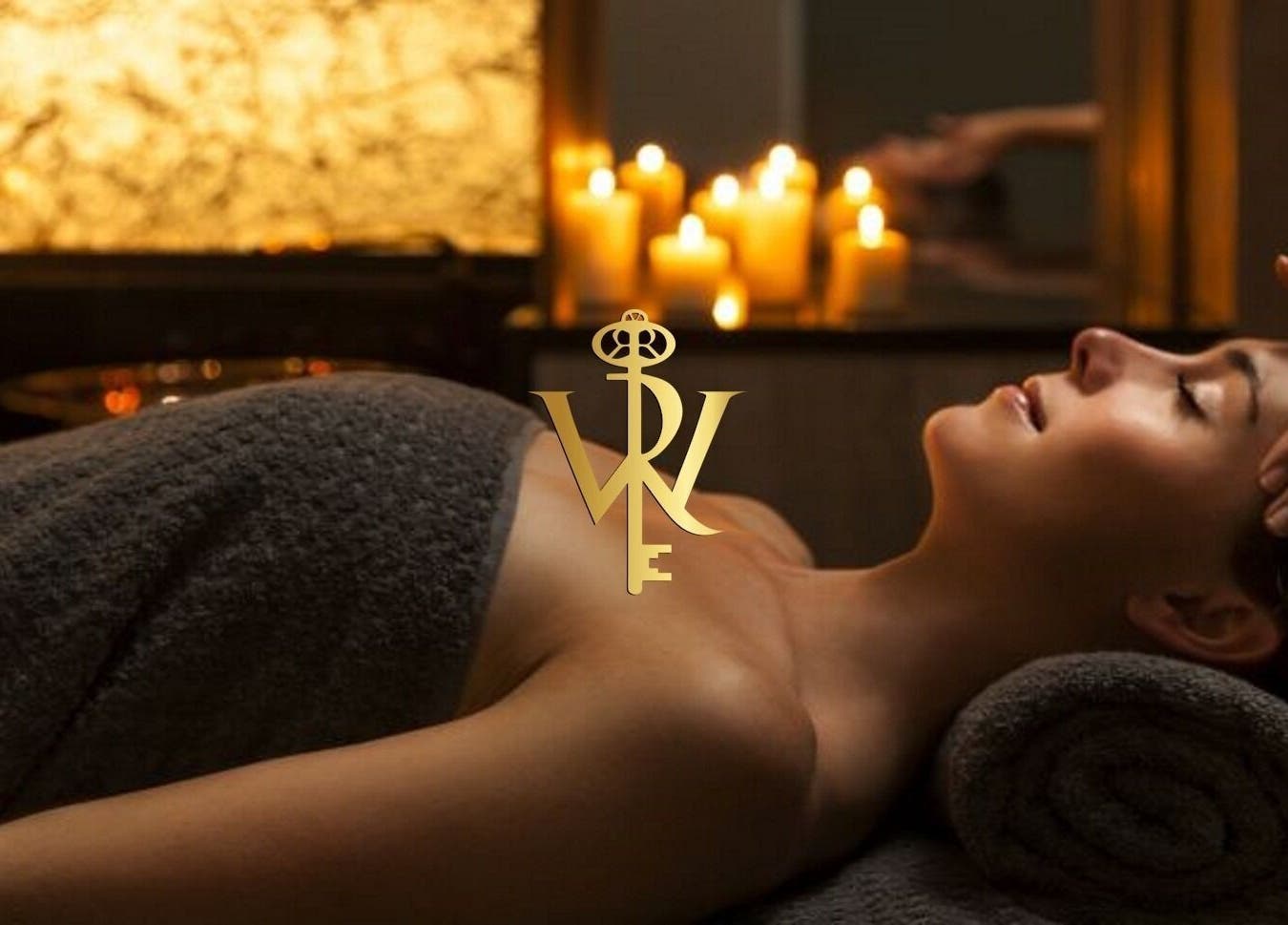 Relaxing massage at Revive the Key to Wellness, Scotland, GB with soothing candlelight ambiance.