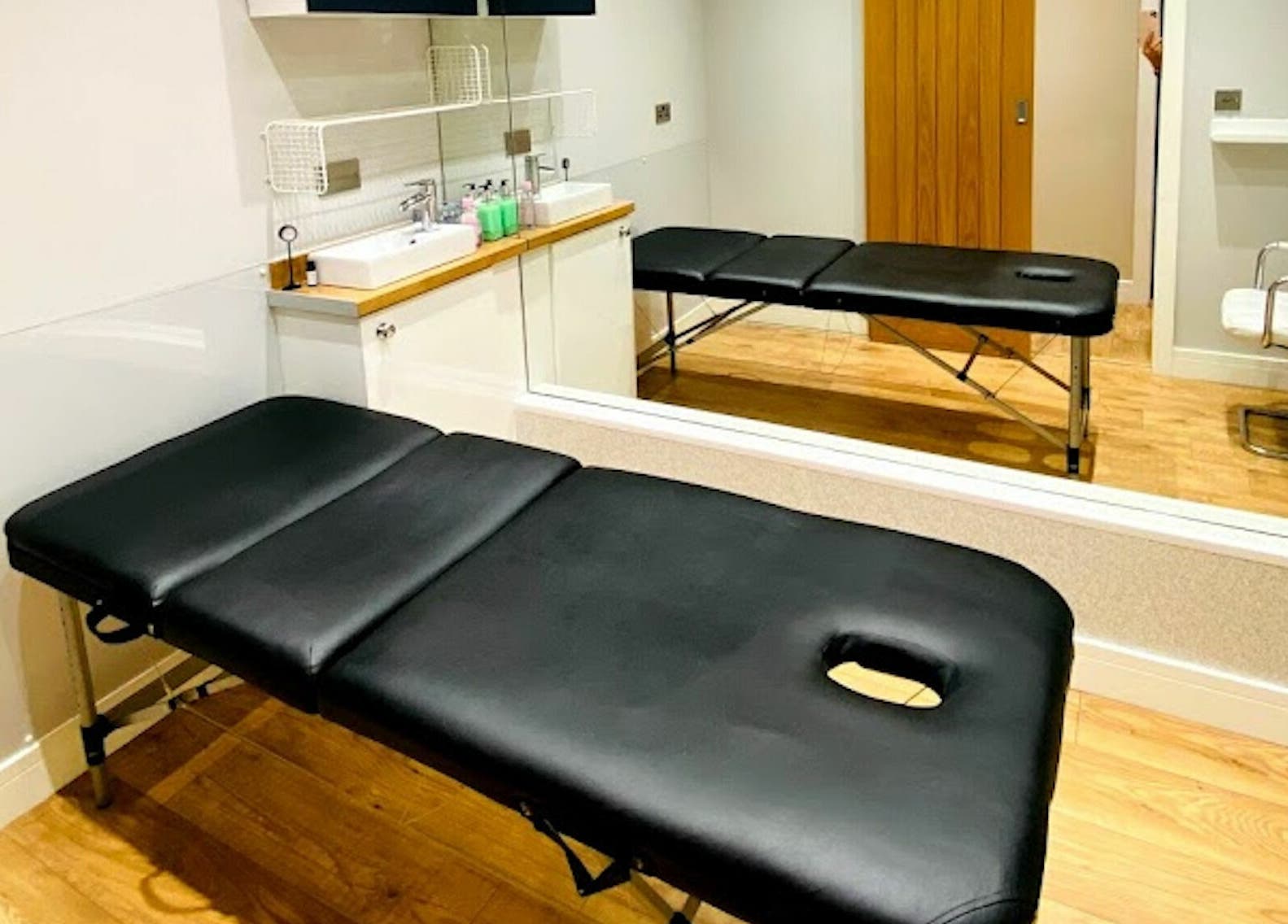 Treatment room at The Beauty Spot, Jarrow, England, GB, featuring a massage table and modern decor.