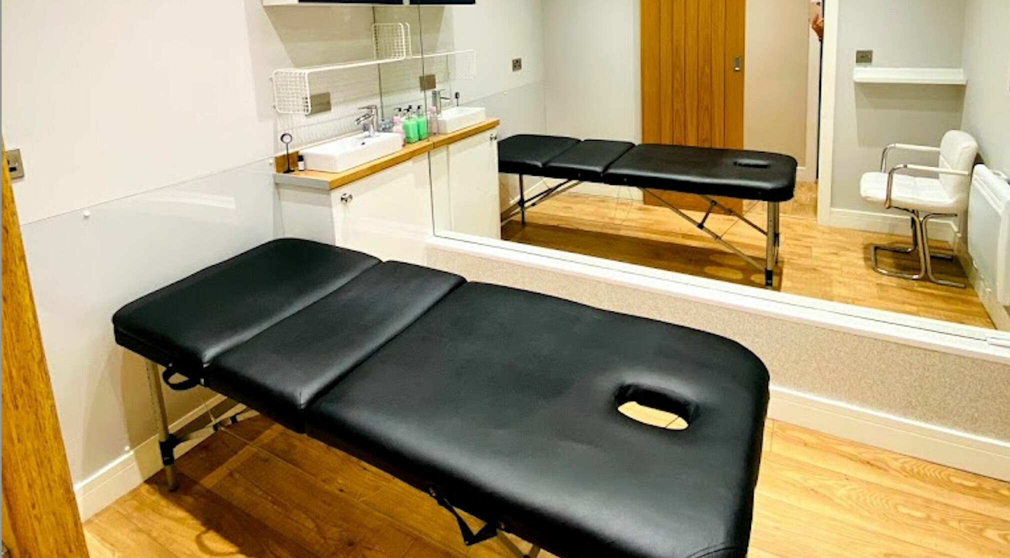 Treatment room at The Beauty Spot, Jarrow, England, GB, featuring a massage table and modern decor.