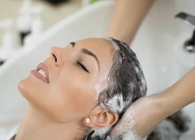 Relaxing hair wash at Headquarters Salon, Reading, England, GB. Experience bliss in our stylish setting.