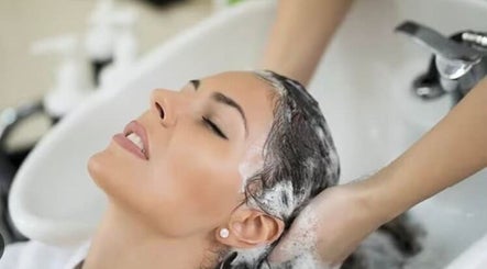 Relaxing hair wash at Headquarters Salon, Reading, England, GB. Experience bliss in our stylish setting.