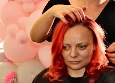 Professional stylist adjusting vibrant hair at Headquarters Salon, Reading, England, GB.