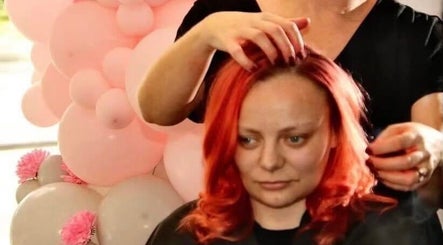 Professional stylist adjusting vibrant hair at Headquarters Salon, Reading, England, GB.